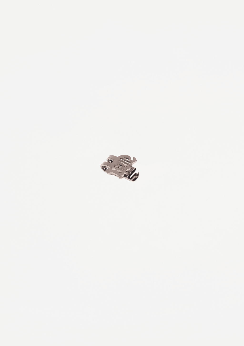 Silver-tone cap pin with textured raised front