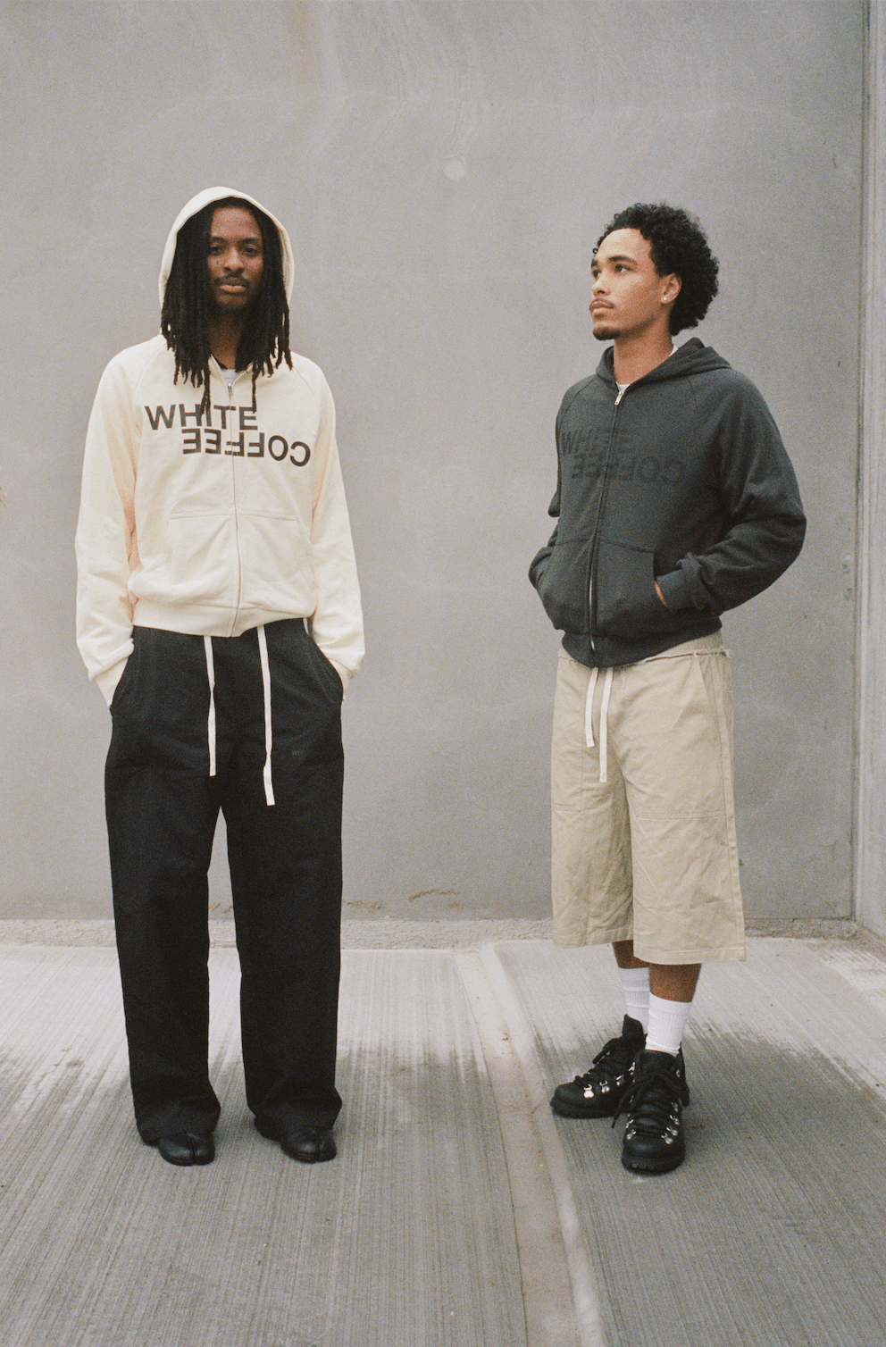 Dark slate gray zip hoodie, hood and front pocket, worn with drawstring hem.