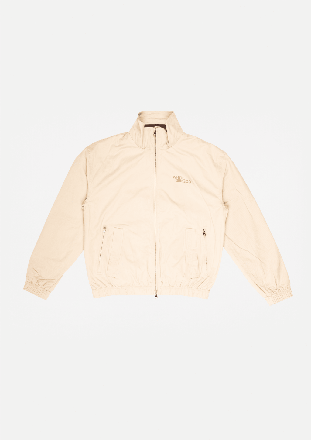 Beige funnel-neck jacket front view, zipped with chest pockets