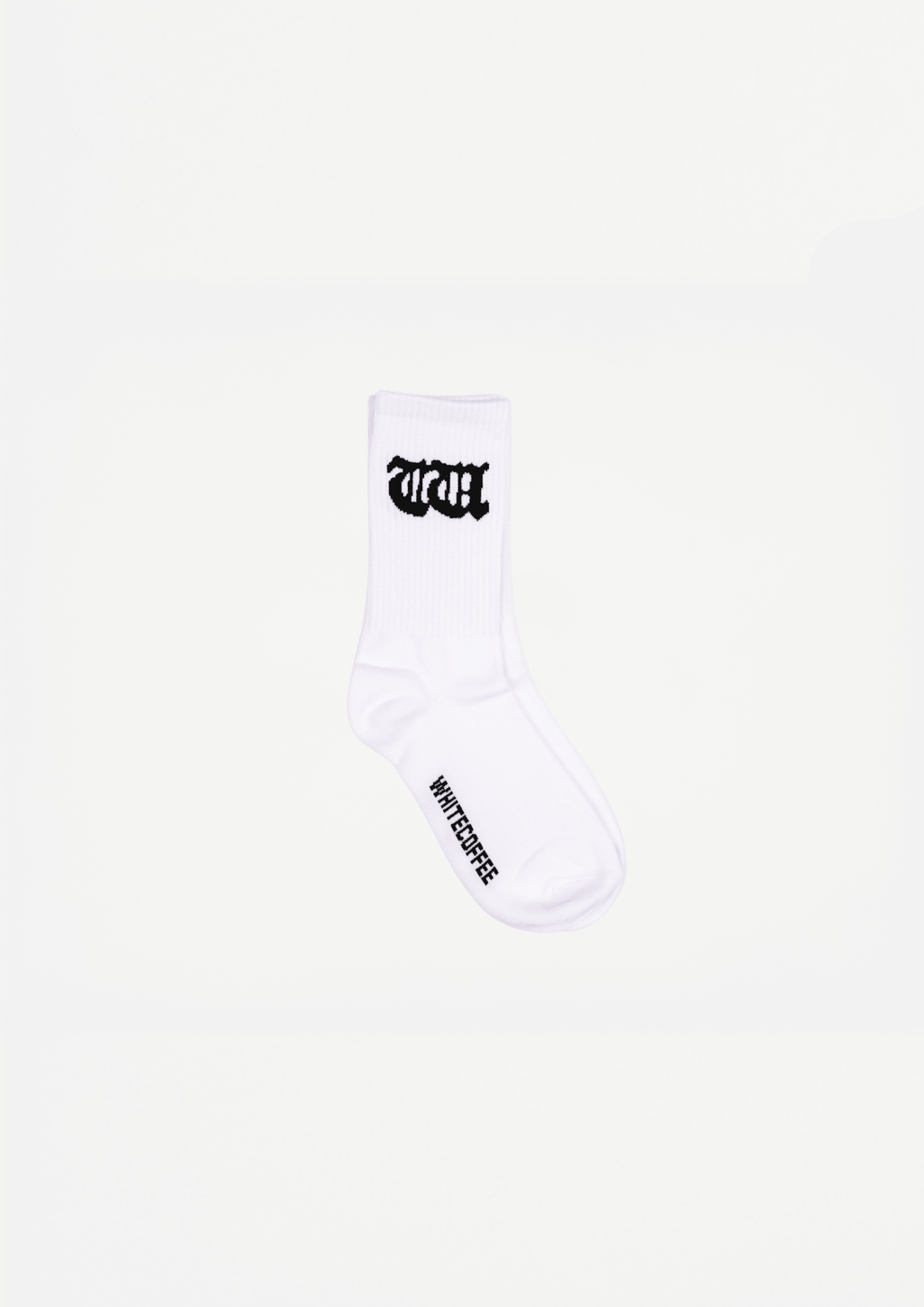 White crew socks with black logo on leg and small text