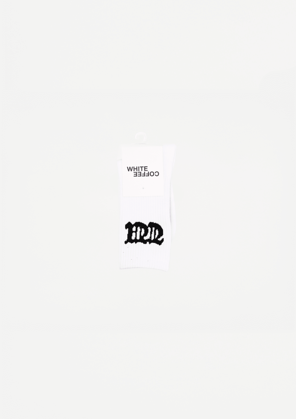 White crew socks with black logo print on hanging packaging
