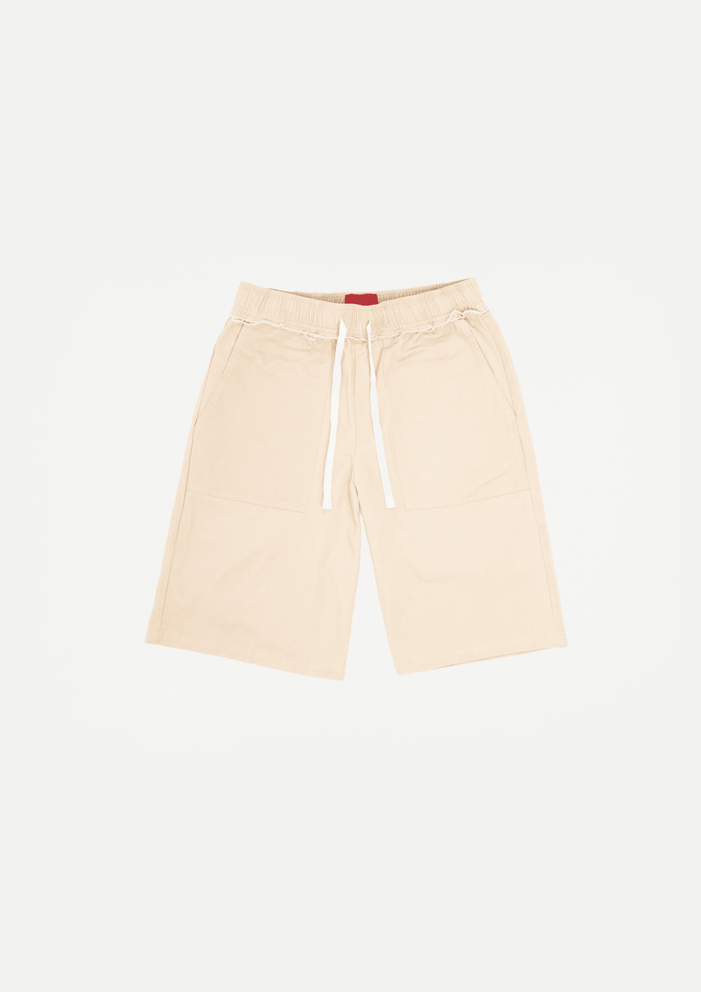 Beige canvas shorts with raw edge hem, drawstring waist, and front pockets